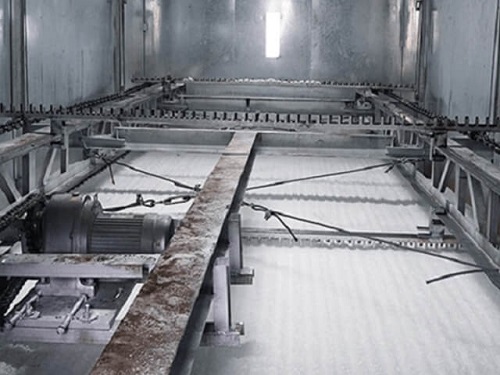 Macchina per la produzione di ghiaccio a scaglie con sistema di rastrellatura del ghiaccio 1
